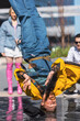 Vertical Screen: Young And Athletic B-Boy Breakdancing To Break Beats On The City Street In The Circle Of Friends. Group Of Fashionable People Supporting Professional Performer Who Is Doing Headspin.