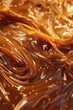 Dive into the rich, amber depths of liquid caramel, its velvety texture swirling in deliciously tempting patterns
