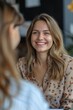 © jureephorn - Smiling female manager interviewing job applicants in the office modern decoration