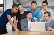 © peopleimages.com - Internship, people and office with laptop for teamwork, collaboration and training with mentor. Support, help and learning with technology for career growth, progress and review as web designers