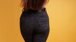 backside of woman wearing tight black denim jeans