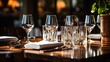 b'Elegant restaurant table setting with wine glasses and silverware'