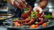 Gourmet Cuisine: Chef's Meticulous Arrangement of Grilled Octopus Delicacy