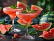 A refreshing watermelon margarita, garnished with a watermelon slice and a sprig of mint.