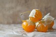 Tart cape gooseberry with papery husk and sweet, tangy flavor, adding brightness to any composition