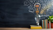 © Mangata Imagine - A light bulb with doodles of icons, symbolizing creative thinking in blackboard background. Copy space area. Teachers day. Back to school. Student day