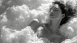 Black and white image of a woman relaxing in a bath made of white cotton fabric material