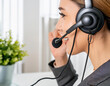 young woman profile customer service representative wearing a headset and providing assistance to line customers