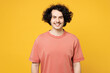 Young smiling happy satisfied cheerful man he wear pink t-shirt casual clothes look camera with toothy smile isolated on plain yellow orange wall color background studio portrait. Lifestyle concept.