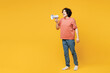 Full body young shocked man he wears pink t-shirt casual clothes hold in hand megaphone scream announces discounts sale Hurry up isolated on plain yellow orange background studio. Lifestyle concept.