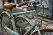 Artistic Detail of a Retro Bicycle with Peeling Turquoise Paint and Rust Showcasing Time's Effect