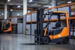 Orange forklift parked in modern warehouse