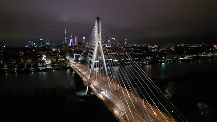 Wall Mural - Swietokrzyski Bridge over the Vistula River with a panoramic view of the center of Warsaw at night. Poland
