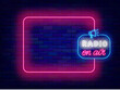 Radio on air neon poster. Music and podcast. Online streaming banner. Greeting card. Empty pink frame and megaphone symbol. Glowing banner. Editing text. Vector stock illustration