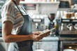 Managing Inventory at a Coffee Shop with a Tablet. Concept Inventory Management, Tablet Apps, Coffee Shop Operations, Product Tracking, Technology Solutions