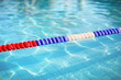 Swimming pool water surface and rope lane marker background