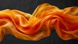   Orange-yellow fabric fluttering in wind against black backdrop Text/Image space ..OR..Black background: