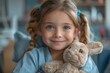 Adorable young girl in blue holding her favorite stuffed bunny, showcasing innocence and joy