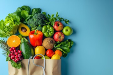 Poster - Overhead perspective captures a paper bag brimming with assorted fresh fruits and vegetables, set against a blue surface, featuring generous copy space, perfect for conveying messages about healthy ea