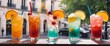 Colorful alhohol cocktails in glasses on bar counter against urban city background. Assortment of fresh summer drinks. Generative AI