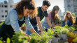© mikeosphoto - Urban gardening workshop on a sunny rooftop. Diverse group of people of different ages and ethnicities planting herbs and small vegetables in recycled containers
