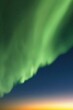 Green aurora borealis. Northern lights and dark night starry sky