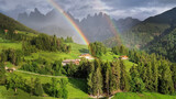 Fototapeta Most - Stunning Alpine scenery of breathtaking Dolomites rocks mountains with double rainbow in Italian Alps, South Tyrol Alto adige , Italy. view of Val di Funes and village Santa Maddalena