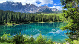 Fototapeta Most - Italy Idyllic nature scenery- trasparent mountain lake Carezza surrounded by Dolomites rocks- one of the most beautiful lakes of Alps. South Tyrol region.