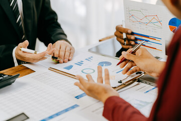 Corporate business people working in busy marketing office space, planning strategy in books and reading email on laptop at work, workers at startup advertising company