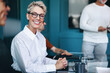 © Jacob Lund - Caucasian business woman smiling happily in a team meeting at work