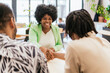 © ADDICTIVE STOCK - Positive Networking Handshake in Coworking Space
