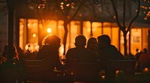 Silhouette Of Group Of People Sitting In Cafe