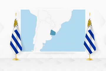 Wall Mural - Map of Uruguay and flags of Uruguay on flag stand.