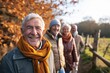 © Enrique - Portrait of happy senior couple with their family in the countryside.