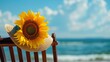 An empty beach chair with a bright yellow sunflower hat resting on it, overlooking a glistening ocean on a sunny day.