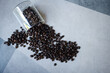 Pile of roasted coffee beans from glass cup
