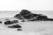 Long exposure black and white photos of coastline scenery.