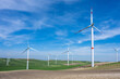 Wind turbines and green agricultural landscape seen in southern Italy