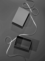 Wall Mural - gift box with ribbon on black background for social media post, story, campaign, product promo, poster, flyer etc. 3d isolated top view luxury layout design