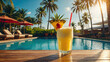 Fruit cocktail Pina colada, shake on a tropical beach against the background the hotel's swimming pool, with accessories, sunglasses, hat, straw, pineapple
