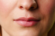 Close-Up of a Womans Lips and Nose With a Neutral Expression