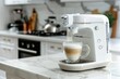 © ffunn - Coffee machine making coffee on white marble table in modern kitchen