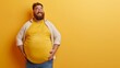 © Natalia - Cheerful overweight man with beard in yellow t-shirt against a yellow background.