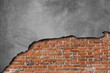 The walls are peeling the red bricks are visible texture background.