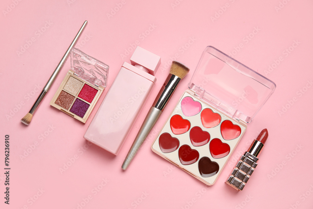 Set of makeup cosmetics on pink background. Top view