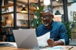 © SHI - A busy young professional businessman checks documents on his laptop in his office. Serious business accounting experts in the workplace read legal documents overview of company documents.