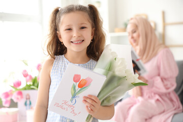 Poster - Little girl with tulips and card for her Muslim mother at home