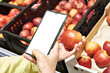 Apple fruit in hand and smartphone