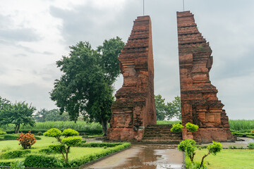 Mojokerto, Indonesia - March 2 2020. Gapura Wringin Lawang is a gate or entrance without a roof from the 14th century Majapahit kingdom. When it's cloudy after rain.