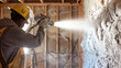 © LomaPari2021 - Shot of worker blowing loosefill insulation into wall cavity.generative ai